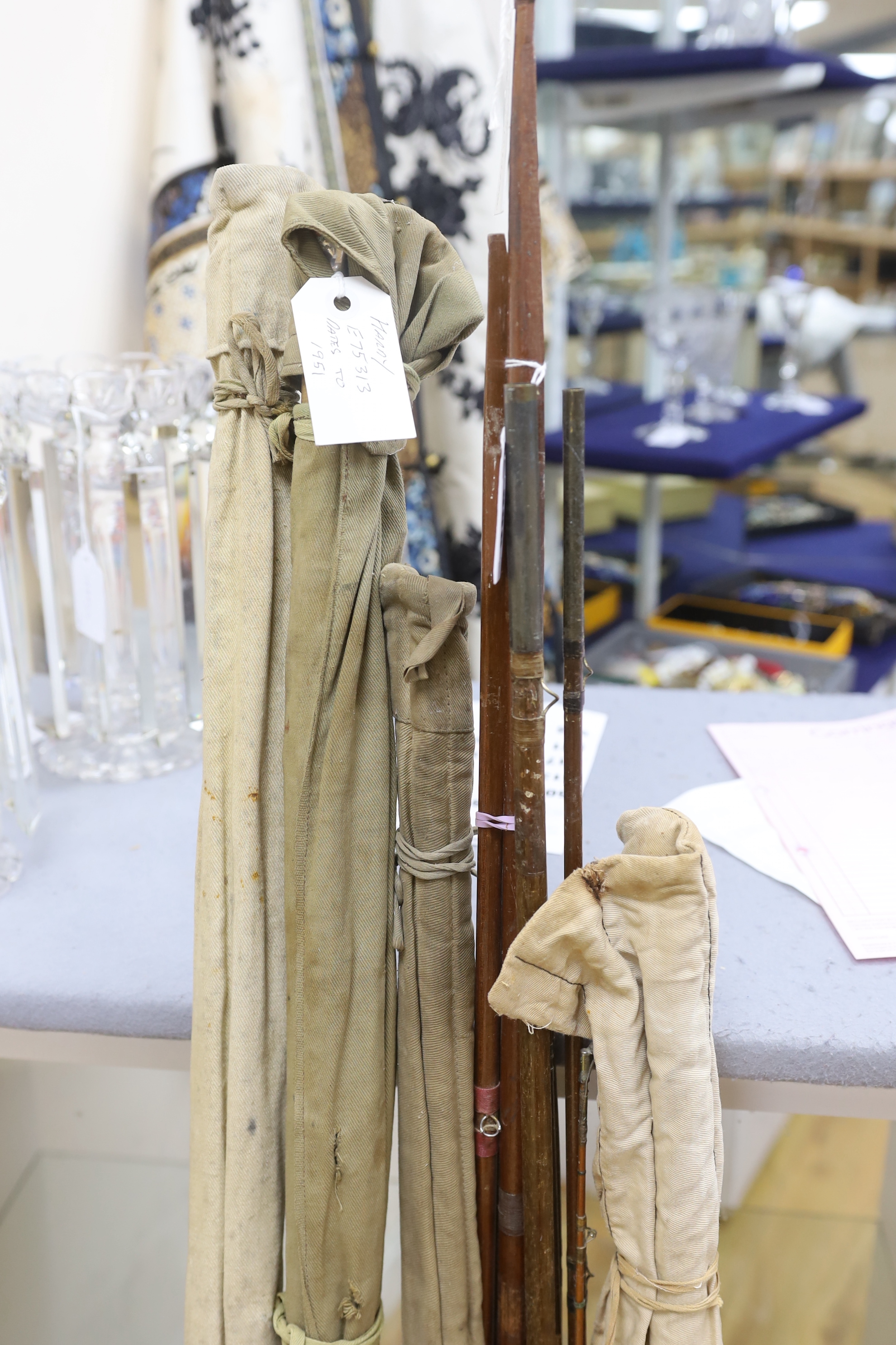 A Hardy fishing rod dated 1951 with cover, a Thorburn and four others, four rods in canvas covers (6)